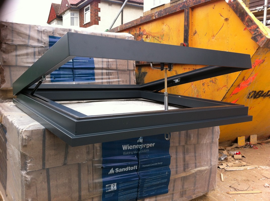 Opening flat roof skylight in anthracite grey installed in Wimbledon