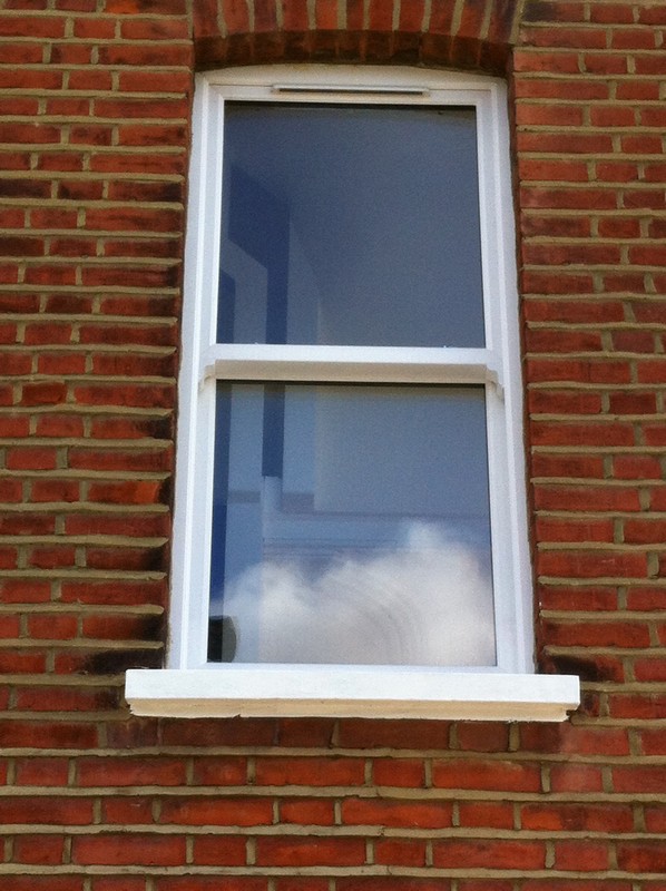uPVC sash window on Victorian red brick house in Wimbledon